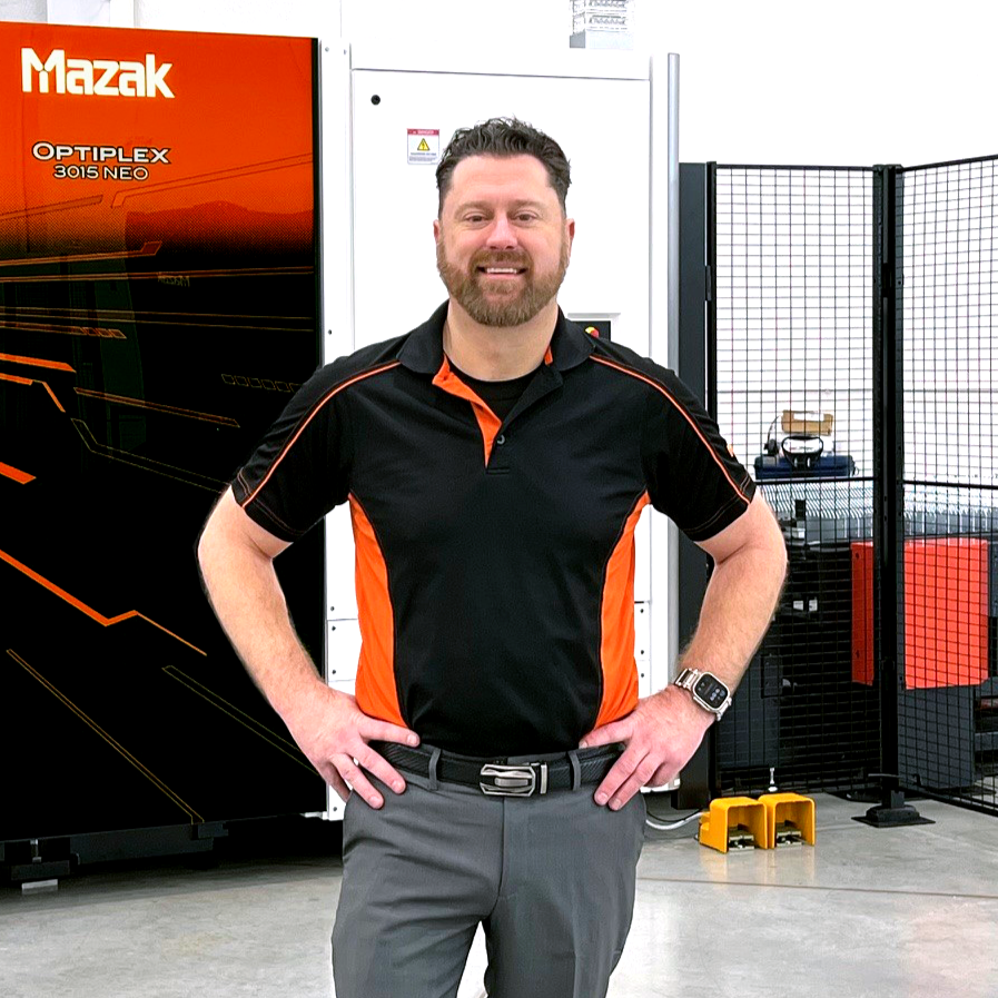 Person Standing in Front of Machine