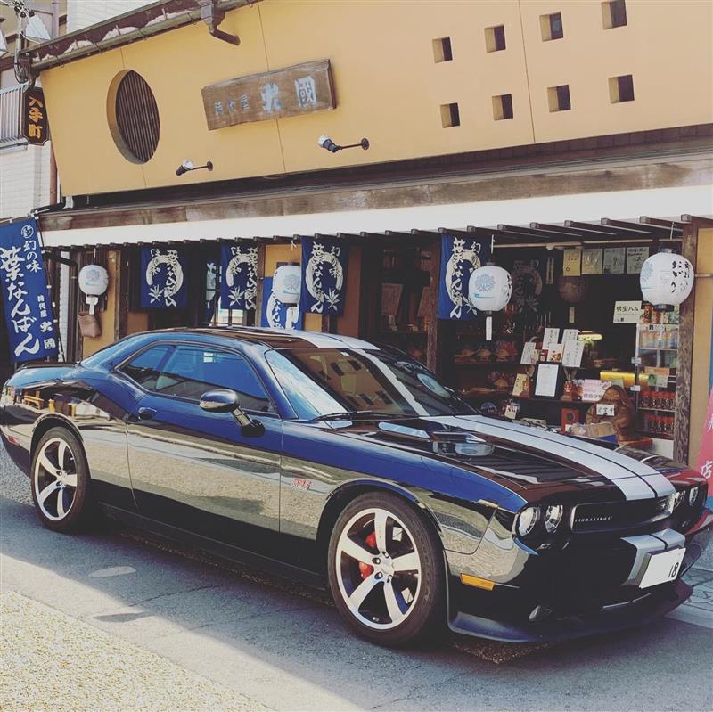 Blue Dodge Challenger with Double White Stripe Down the Middle